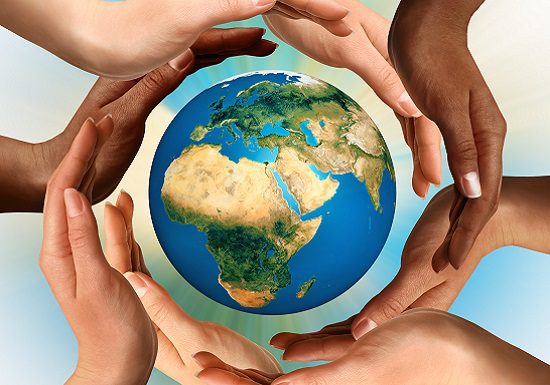 Multiracial Hands Surrounding the Earth Globe