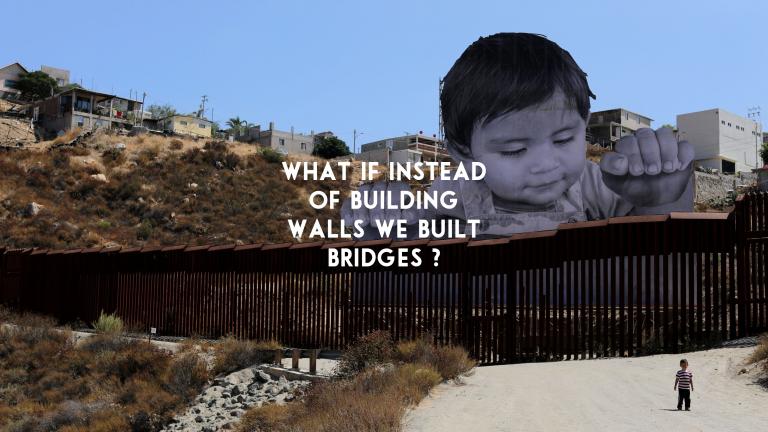 BUILD-BRIDGES-NOT-WALLS-missing-immigrant-children-andy-gill-patheos-art-installation-at-us-mexico-broder-tecate-e1507655266831