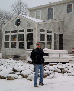 Moi, wearing the tool belt I've owned for 30 years. This is the study I built for myself.  (With an attached deck.)