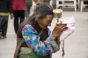 woman with prayer wheel
