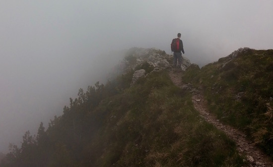 ascending a foggy mountain path