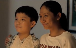 Jiale (Koh Jia Ler) and Teresa (Angeli Bayani), in "Ilo Ilo"