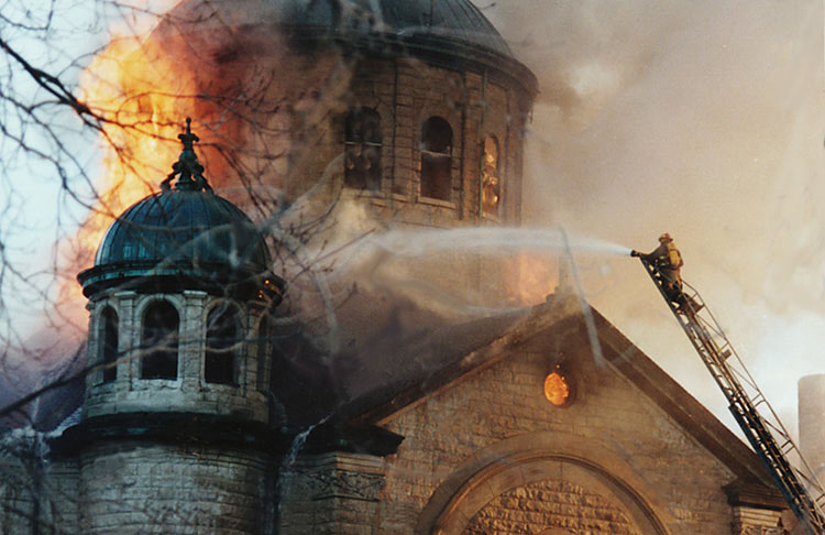 The fire in 1995 destroyed virtually everything but the walls of the church. (photo courtesy of Saints Center)