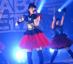 Babymetal in concert, performing their fox hand gesture. By Iancinerate (Own work) [CC BY-SA 3.0 (http://creativecommons.org/licenses/by-sa/3.0) or GFDL (http://www.gnu.org/copyleft/fdl.html)], via Wikimedia Commons