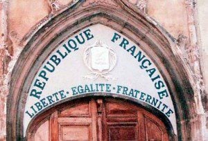 (The tympanum of a church in Aups, France, painted with the motto of the French Republic. Source: Wikimedia, Creative Commons License).