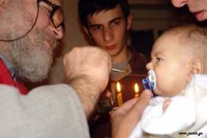 Baptism/Chrismation at a Georgian Orthodox Church by Paata Vardanashvili from Tbilisi, Georgia (christening) [CC BY 2.0 (http://creativecommons.org/licenses/by/2.0)], via Wikimedia Commons