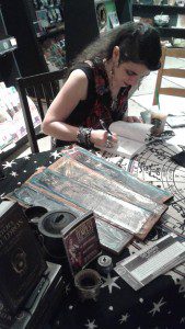 Signing at Magus Books in Minneapolis, photo by Elysia Gallo