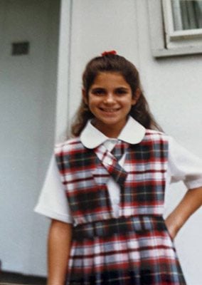 The author in her Catholic school uniform, maybe 4th-5th grade. 