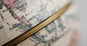 A globe, representing the world. Photo by chuttersnap (in public domain on Unsplash).
