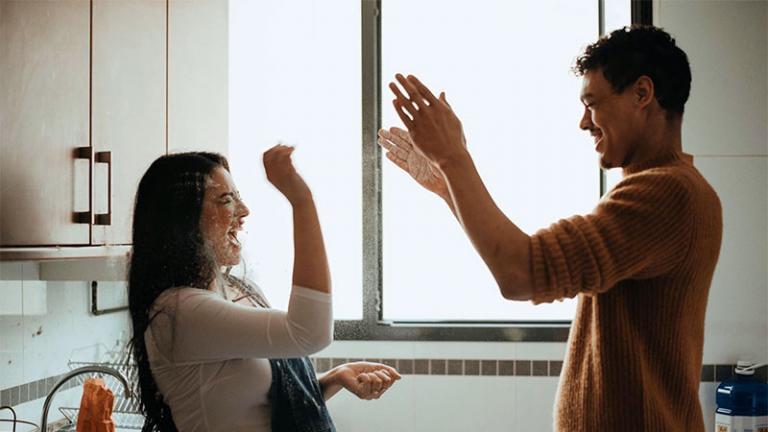 A man and a woman laughing together