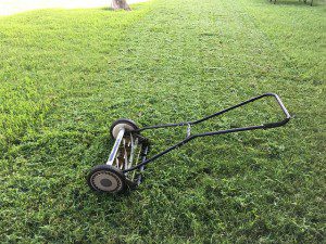 a lawn with an old fashioned mower