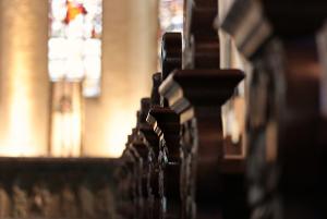 church pews and a stained glass window