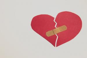 a broken heart held together with a bandage