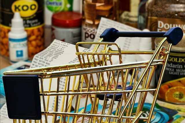 a shopping cart and groceries