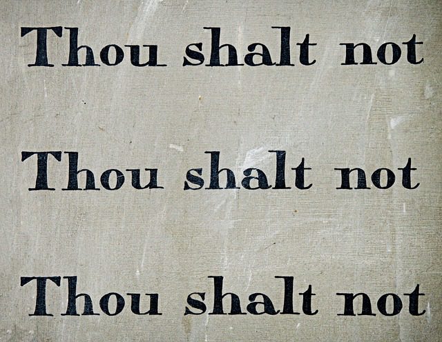 a stone tablet saying "thou shalt not thou shalt not thou shalt not." 