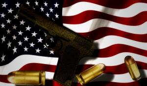 a gun on an American flag