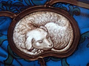 a stained glass window with a picture of a lamb