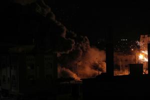 a bomb going off at night, somewhere in Gaza