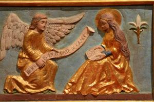 a carving depicting the Angel Gabriel kneeling before the Virgin Mary