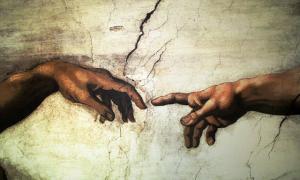 The hand of the Father reaching out to touch the hand of Adam, from Michelangelo's Sistine Chapel