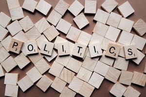 the word "politics" spelled out in scrabble tiles