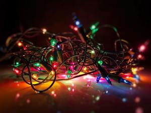 tangled Christmas lights glowing on a dark background