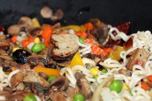 A dish of chicken stir fry with noodles