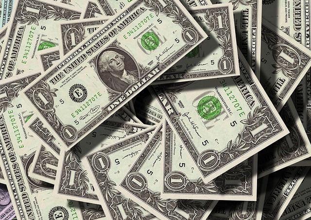 a pile of dollar bills
