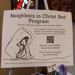 A poster advertising the "Neighbors in Christ bed program" with a sketch drawing of Jesus helping someone drag a twin mattress. The mattress covers most of the other person's body so you only see the foot stepping out behind it.