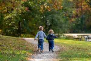 children running in the park. 