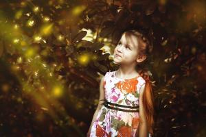 a stock image of a little girl about the Sylph's age, admiring fireflies