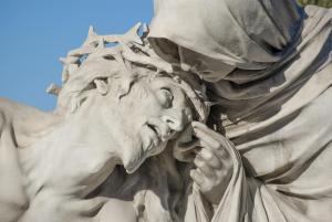 A close-up of a statue of the Pieta from Saint Mary Mejor basilica, showing Jesus's face in detail. How can somebodyv meditate on the sufferings of Mary and her Son, without having compassion on somebody else's disabled son? 