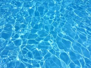 sunshine reflecting off the bottom of a swimming pool