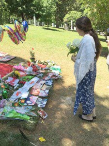 Camille at Ali's grave placing a bouquet of Hydrangeas from our Sufi Zhikr Circle.