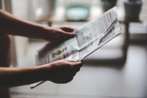 Man Reading Paper by KaboomPics