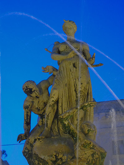 Fontana di Diana (or the Fountain of Artemis) - showing the Goddess Artemis protecting the nereid nymph Arethusa from the advances from the River God. It was sculpted by Giulio Moschetti and errected in 1907, standing at the heart of the Piazza Archimede. Photograph: Sorita d'Este(c) 2015