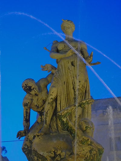 Fontana di Diana (or the Fountain of Artemis) - showing the Goddess Artemis protecting the nereid nymph Arethusa from the advances from the River God. It was sculpted by Giulio Moschetti and errected in 1907, standing at the heart of the Piazza Archimede. Photograph: Sorita d'Este(c) 2015