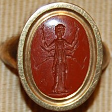 Red Jasper Intaglio, depicting a triple image of Hekate bearing Torches. © The Trustees of the British Museum
