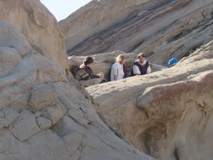 Passion play actors ast a Palm Sunday dress rehearsal. They're standing in a huge split between between geological layers at Vasquez Rocks.
