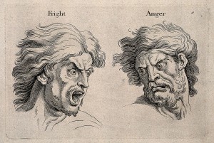 A_frightened_and_an_angry_face,_left_and_right_respectively._Wellcome_V0009326