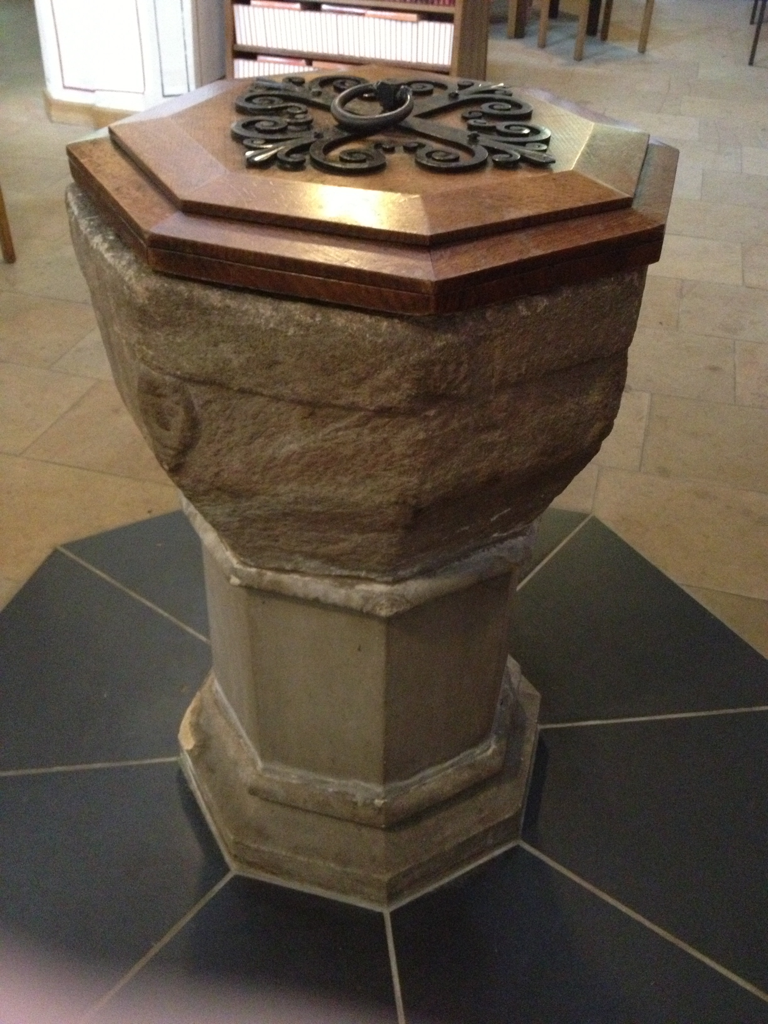 A twelfth century baptismal font from a church in the Peak District. Photo by David Russell Mosley