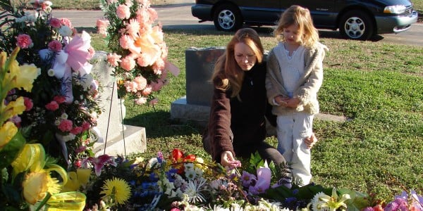 With my daughter by my mother's grave, a few days after the funeral. March, 2007