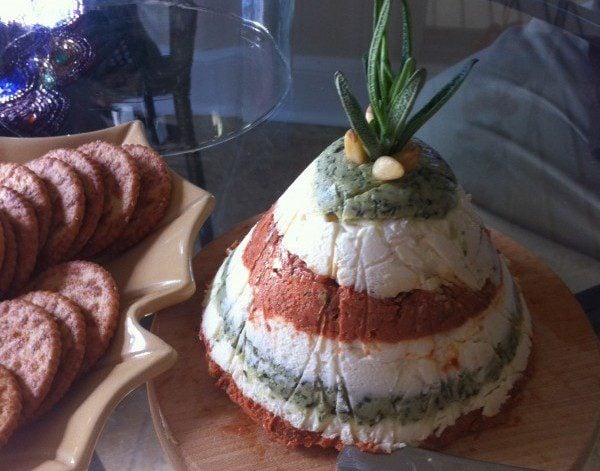 "Deck the Halls" Sun-dried tomato, pesto and cream cheese torta with crackers. Photo by Heron Michelle