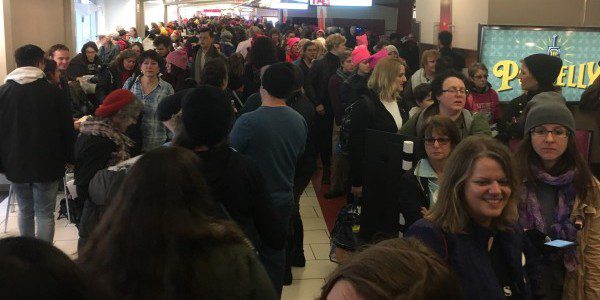 Every one of these people is in line for the same food court restroom that was many blocks away from the March location. Our hero was a plain-clothes officer with a badge that played toilet traffic cop and helped the women use the stalls in the men's room and kept the peace. photo by Heron