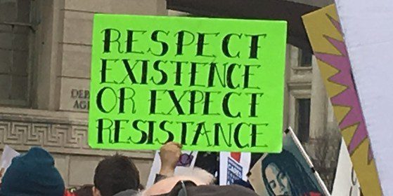 Protest sign reads respect existence or expect resistance