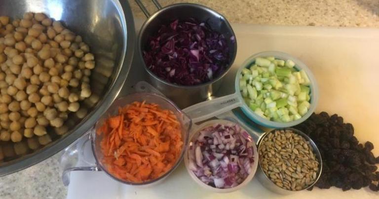 chickpeas, carrots, red cabbage, red onions, celery, sunflower seeds, raisins