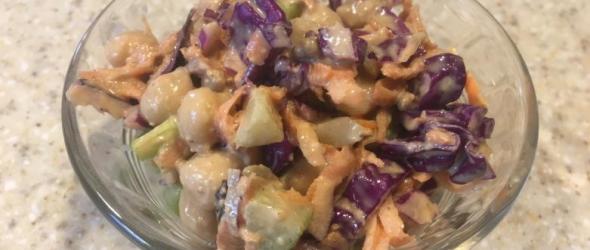 Bowl of Chickpea and red cabbage slaw with tahini dressing
