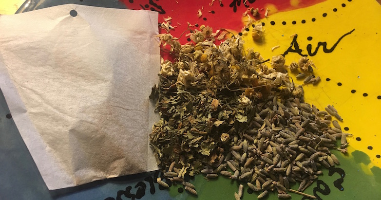 Chamomile, Lavender, and Dandelion Leaf on plate with disposable custom teabag