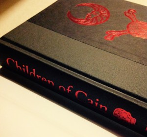 The beautifully embossed cover of my copy of "children of Cain" by Michael Howard 