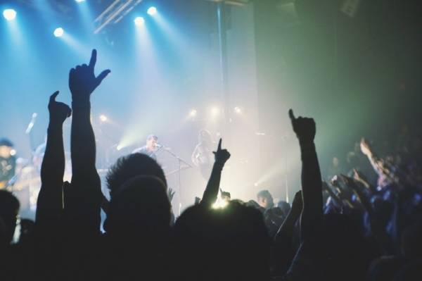 people-raining-hands-at-rock-concert